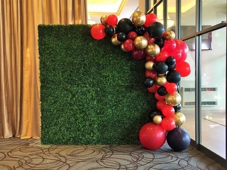 Green-Boxwood-Flower-Wall-London-with-Multi-Coloured-Balloon-Decor-London Party Rentals Network