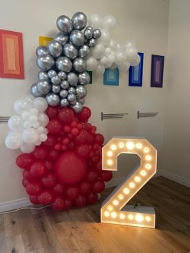 Silver-White-and-Red-Balloon-Decor-with-Bright-Marquee-Letters-London Themes Party Rentals